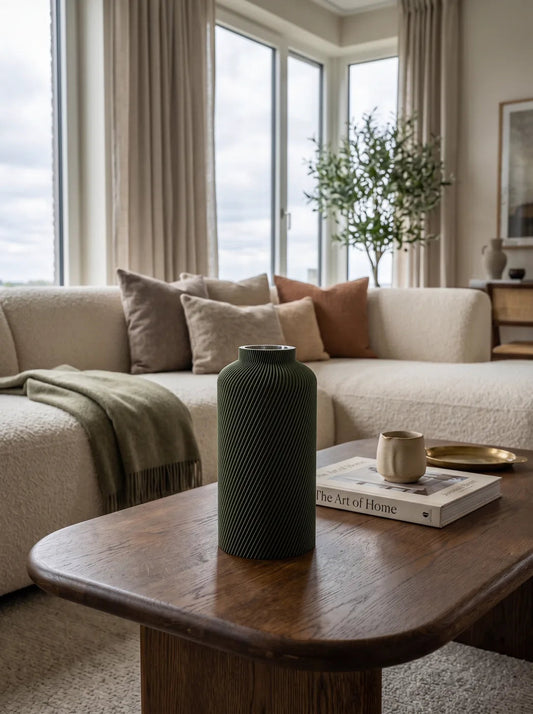 Olive green Silo vase on a wooden coffee table in a light living room