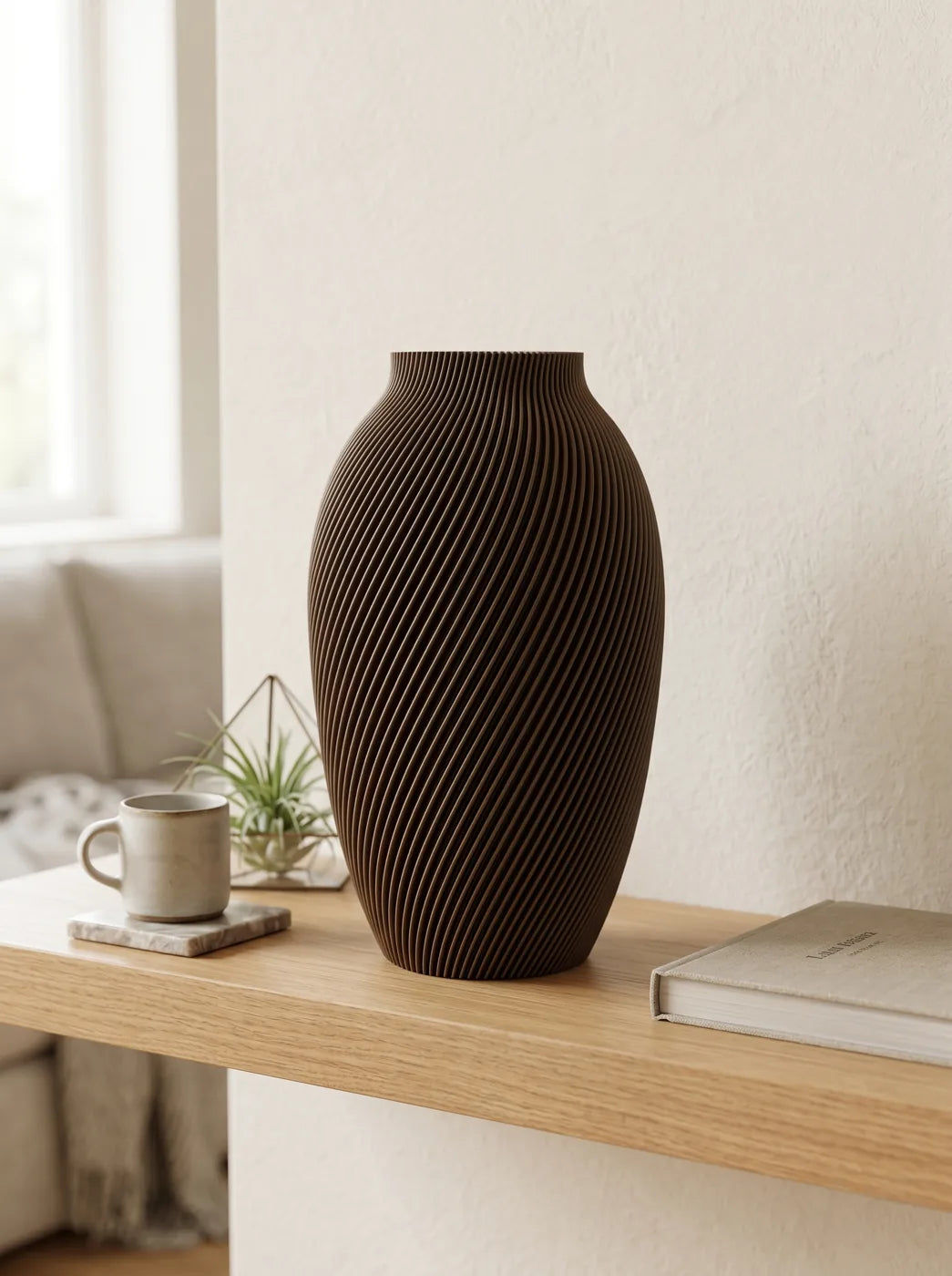 Brown SPIRE vase on an oak shelf