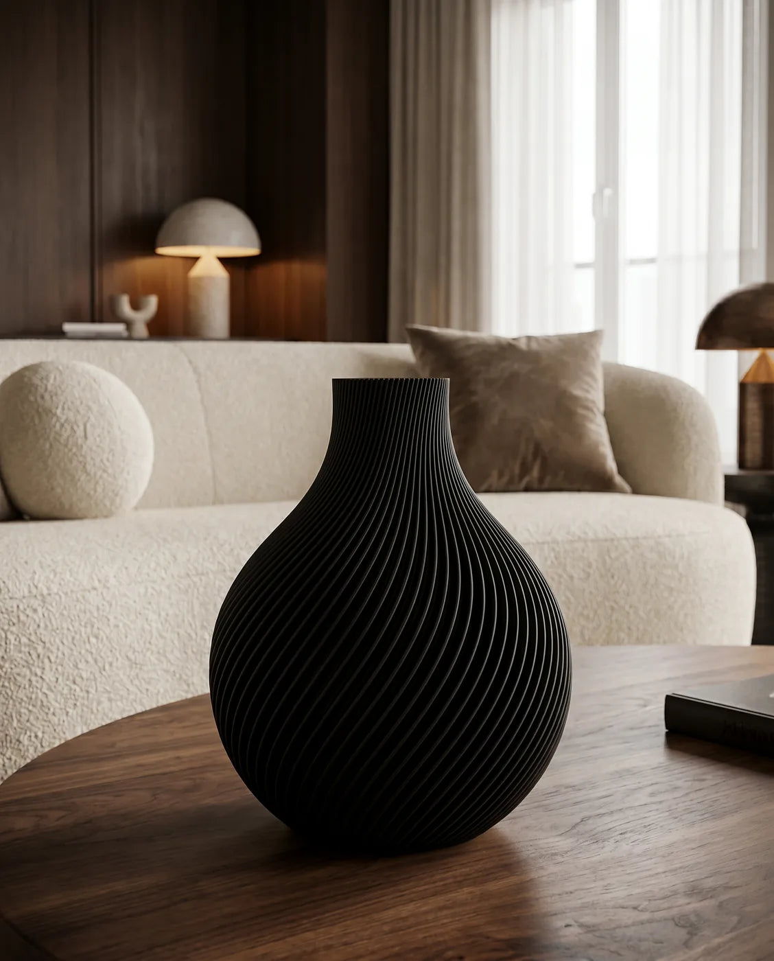Black ORB vase in a softly lit lounge