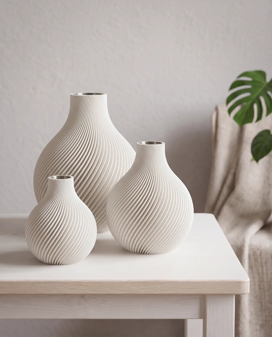 Three white ORB vases in three sizes