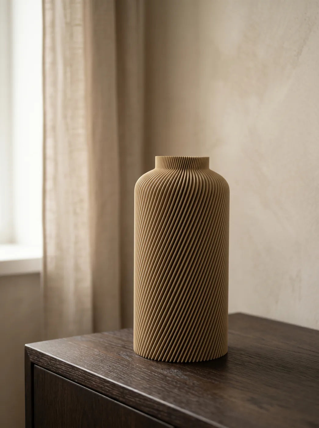 Sand SILO vase on a wood cabinet by a window