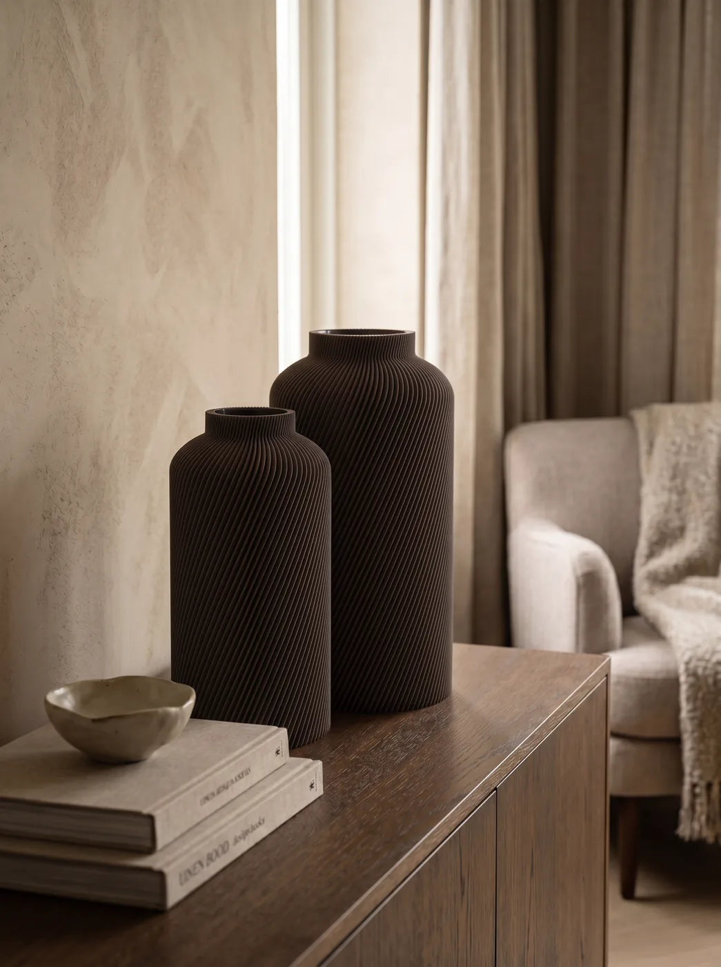 Two brown SILO vases on a sideboard